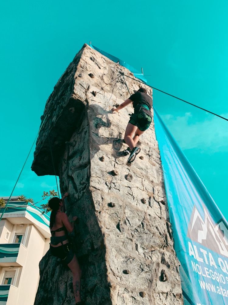 Climbing a bolted rock wall